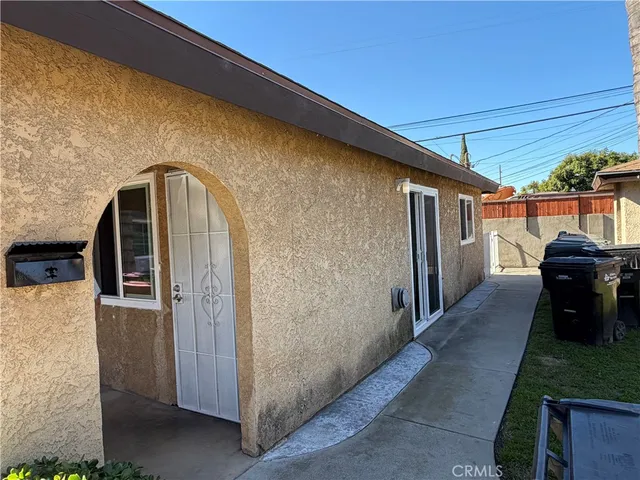 a front view of a house with parking area