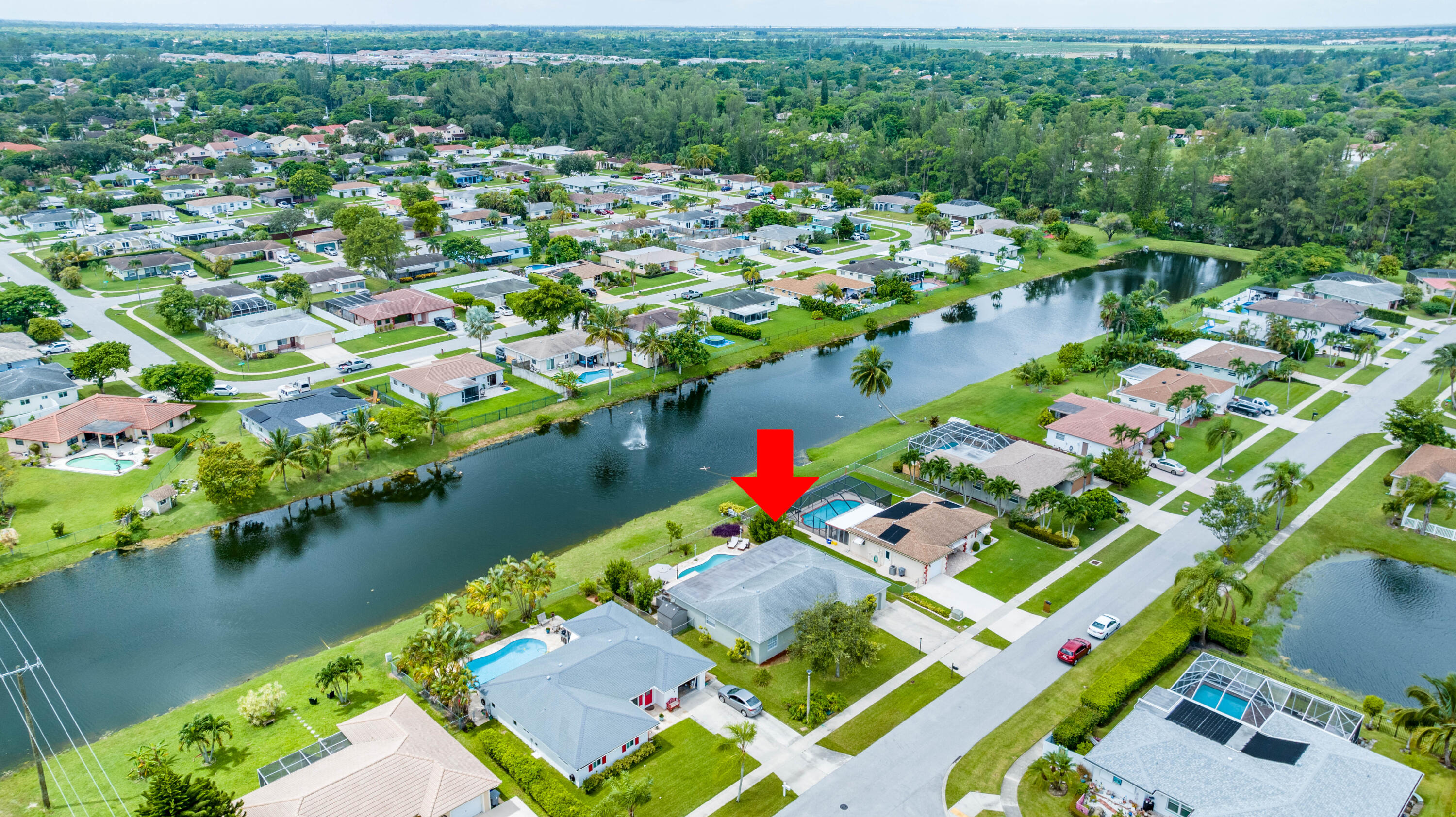 11058 Delta Circle Boca Raton, FL 33428 - Photo 54 of 62 an aerial view of residential houses with outdoor space and lake view