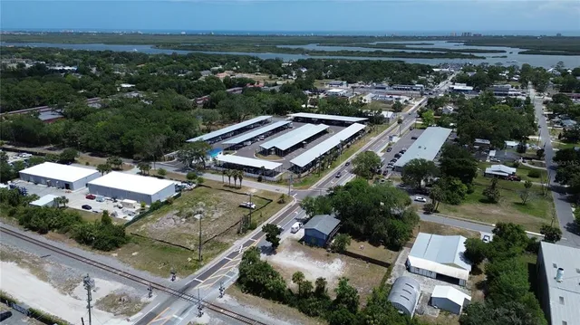 an aerial view of residential houses with outdoor space