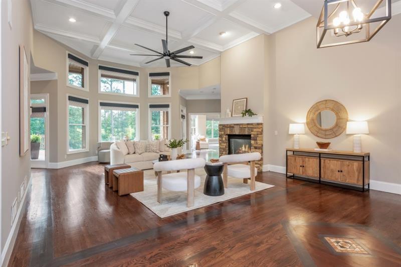 3505 Watson Road Cumming, GA 30028 - Photo 12 of 87 a living room with fireplace furniture and a large window