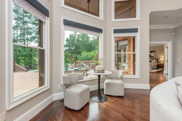 a view of a dining room with furniture window and wooden floor