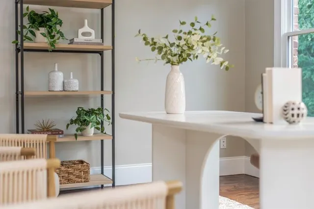 a bathroom with a sink a toilet and a large mirror