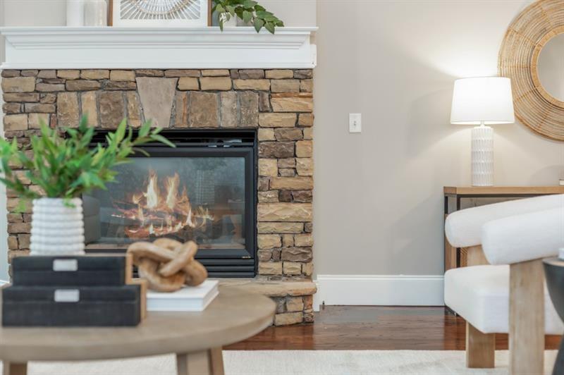 3505 Watson Road Cumming, GA 30028 - Photo 40 of 87 a living room with furniture and a fireplace