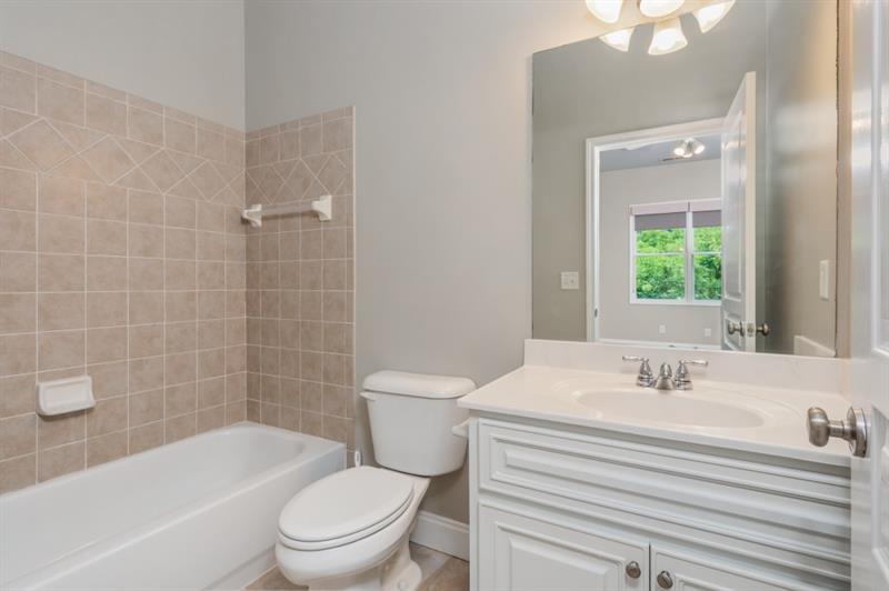 3505 Watson Road Cumming, GA 30028 - Photo 59 of 87 a bathroom with a sink a toilet and shower