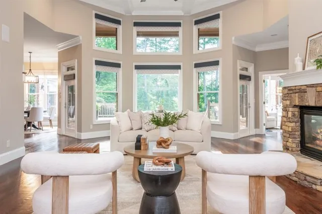 a dining room with furniture and wooden floor
