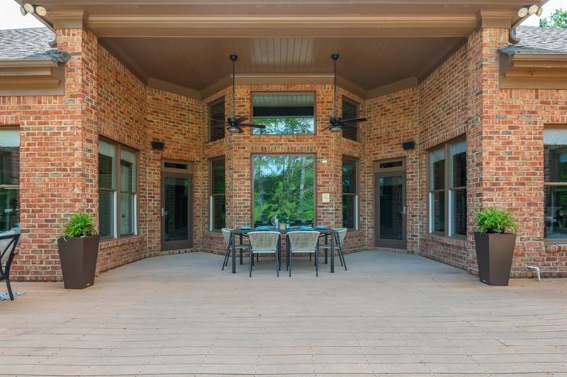 3505 Watson Road Cumming, GA 30028 - Photo 73 of 87 a view of a patio with a table and chairs and potted plants