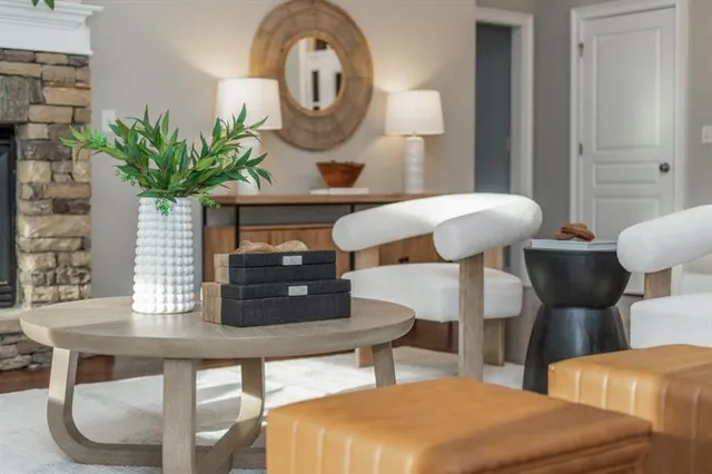a living room with furniture and a chandelier