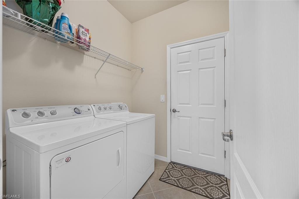 11693 Eros Road Lehigh Acres, FL 33971 - Photo 15 of 21 a utility room with dryer and washer