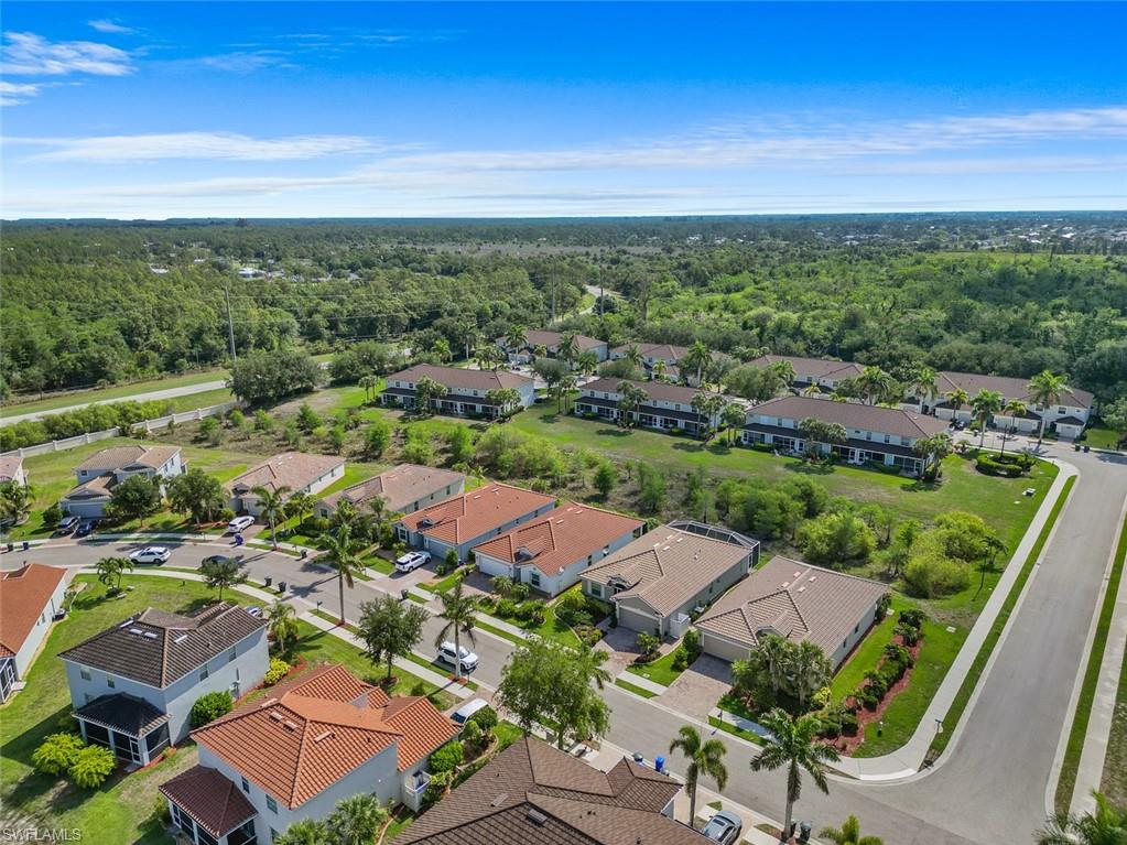 11693 Eros Road Lehigh Acres, FL 33971 - Photo 18 of 21 an aerial view of residential houses with outdoor space