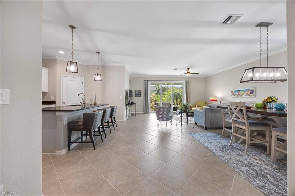 11693 Eros Road Lehigh Acres, FL 33971 - Photo 3 of 21 a view of a dining area with furniture