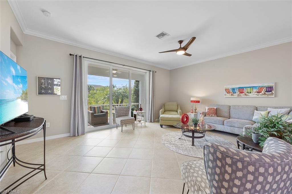 11693 Eros Road Lehigh Acres, FL 33971 - Photo 8 of 21 a living room with furniture and a large window