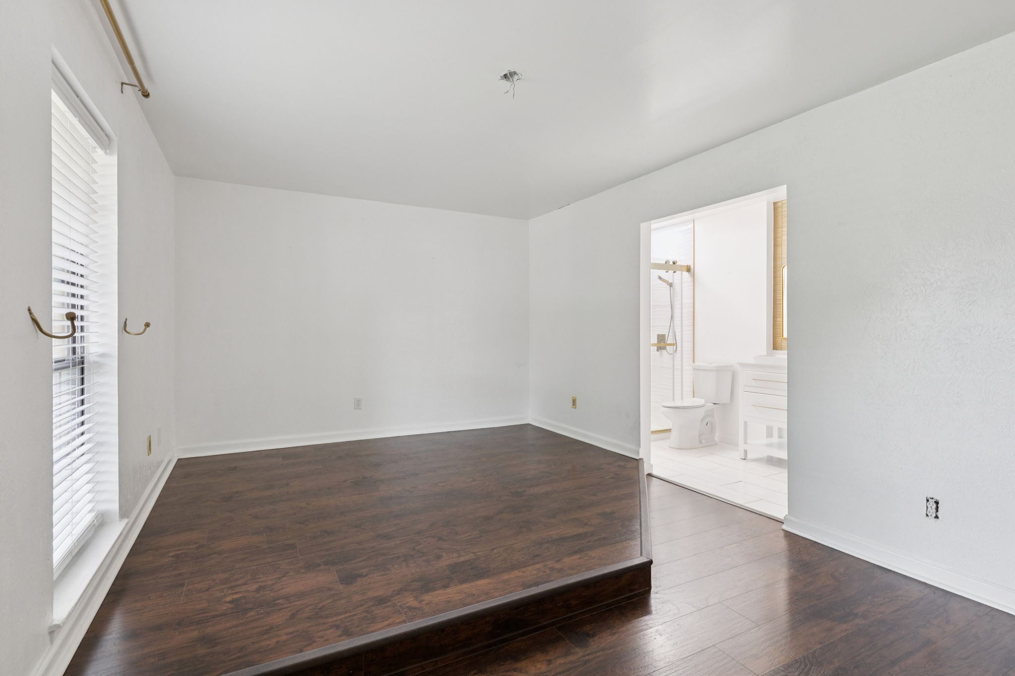 910 Via Valencia Mesquite, TX 75150 - Photo 14 of 23 an empty room with wooden floor