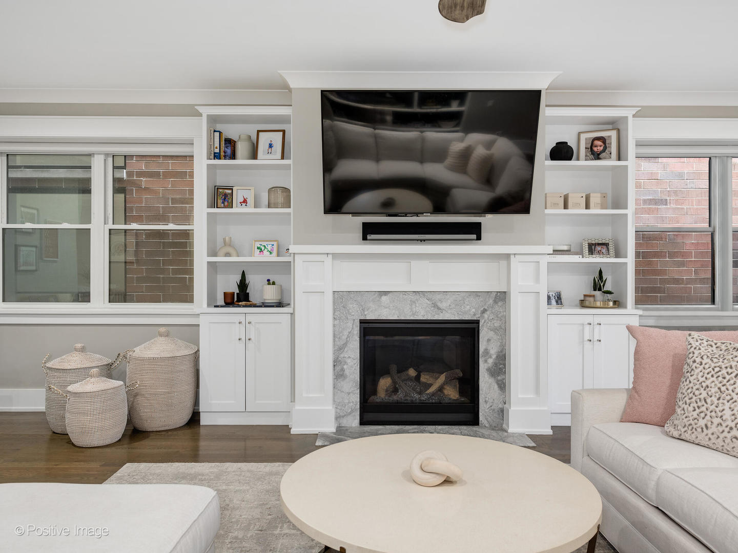 2315 West Roscoe Street, Unit 1 Chicago, IL 60618 - Photo 17 of 37 a living room with furniture and a fireplace