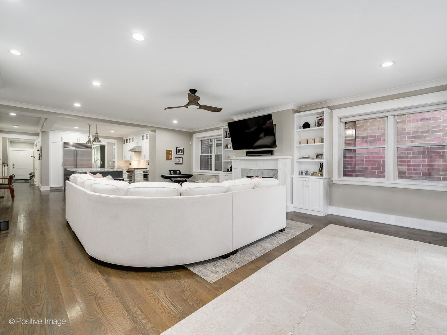 2315 West Roscoe Street, Unit 1 Chicago, IL 60618 - Photo 19 of 37 a living room with furniture and a flat screen tv