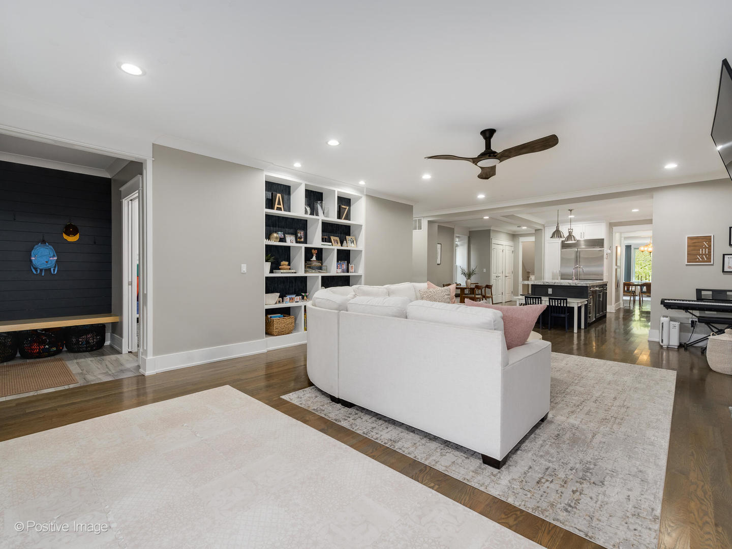 2315 West Roscoe Street, Unit 1 Chicago, IL 60618 - Photo 20 of 37 a living room with couches and a flat screen tv