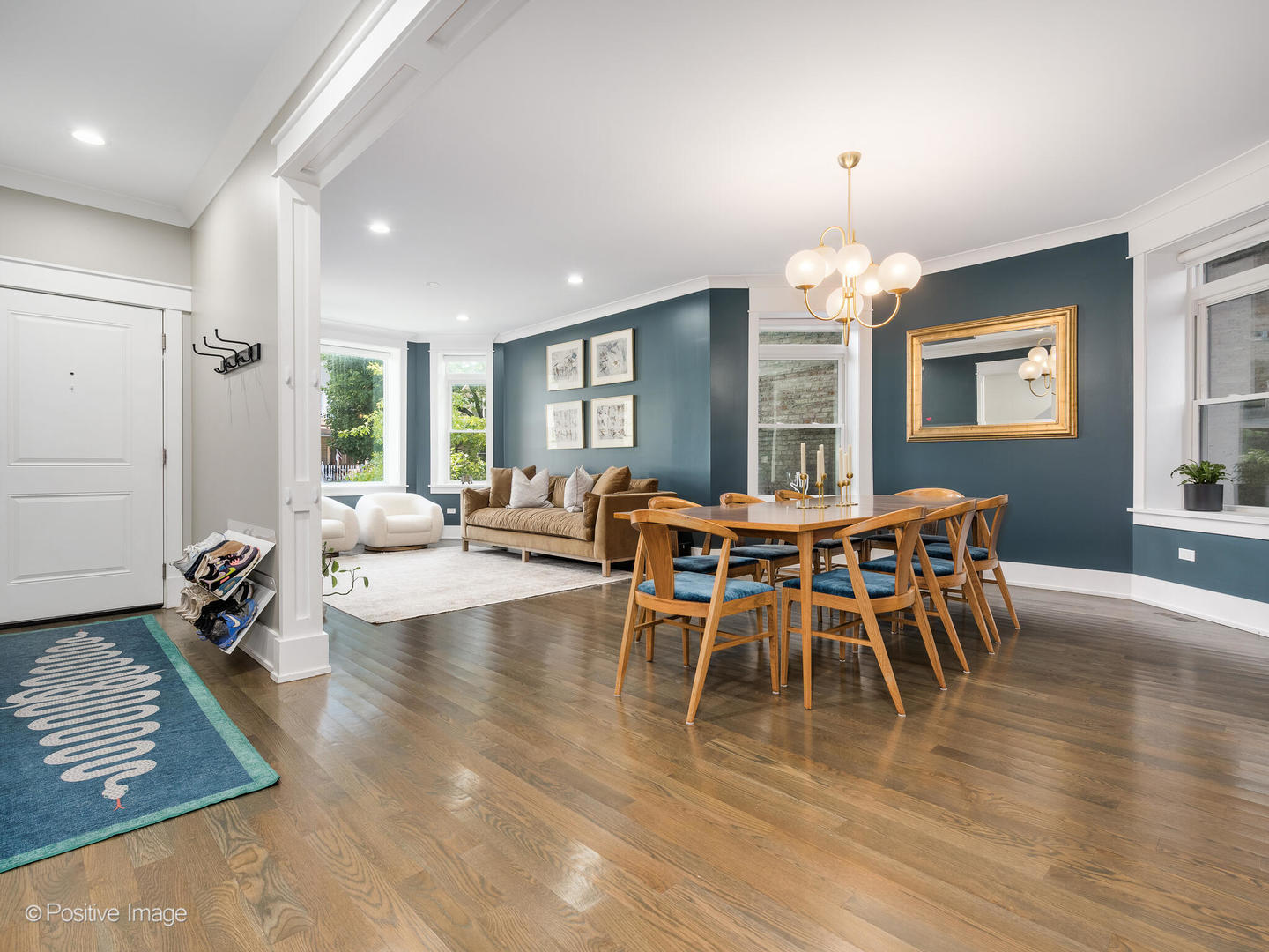 2315 West Roscoe Street, Unit 1 Chicago, IL 60618 - Photo 2 of 37 a view of a dining room with furniture a chandelier and wooden floor