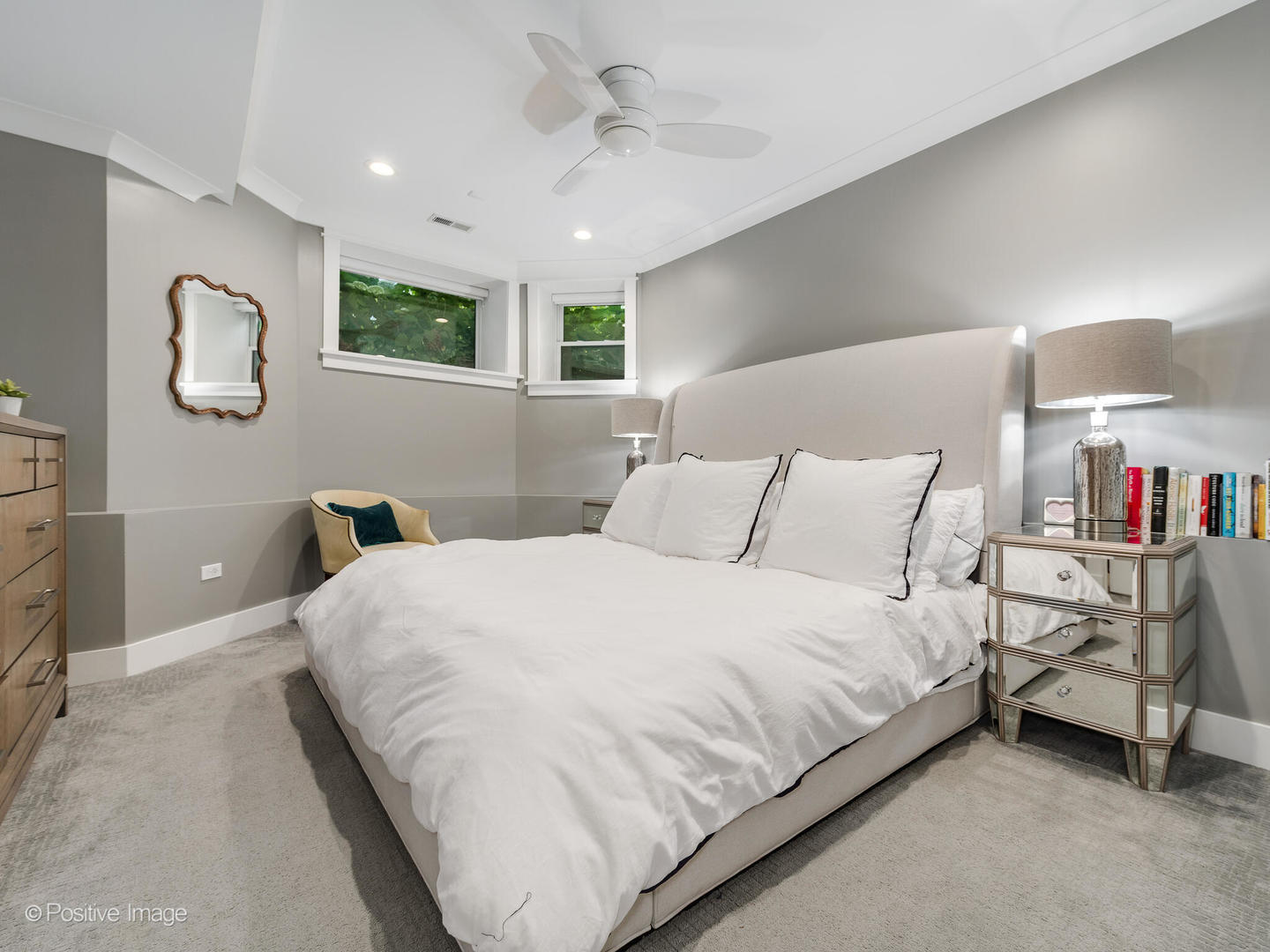 2315 West Roscoe Street, Unit 1 Chicago, IL 60618 - Photo 23 of 37 a bedroom with a bed and a lamp on wall