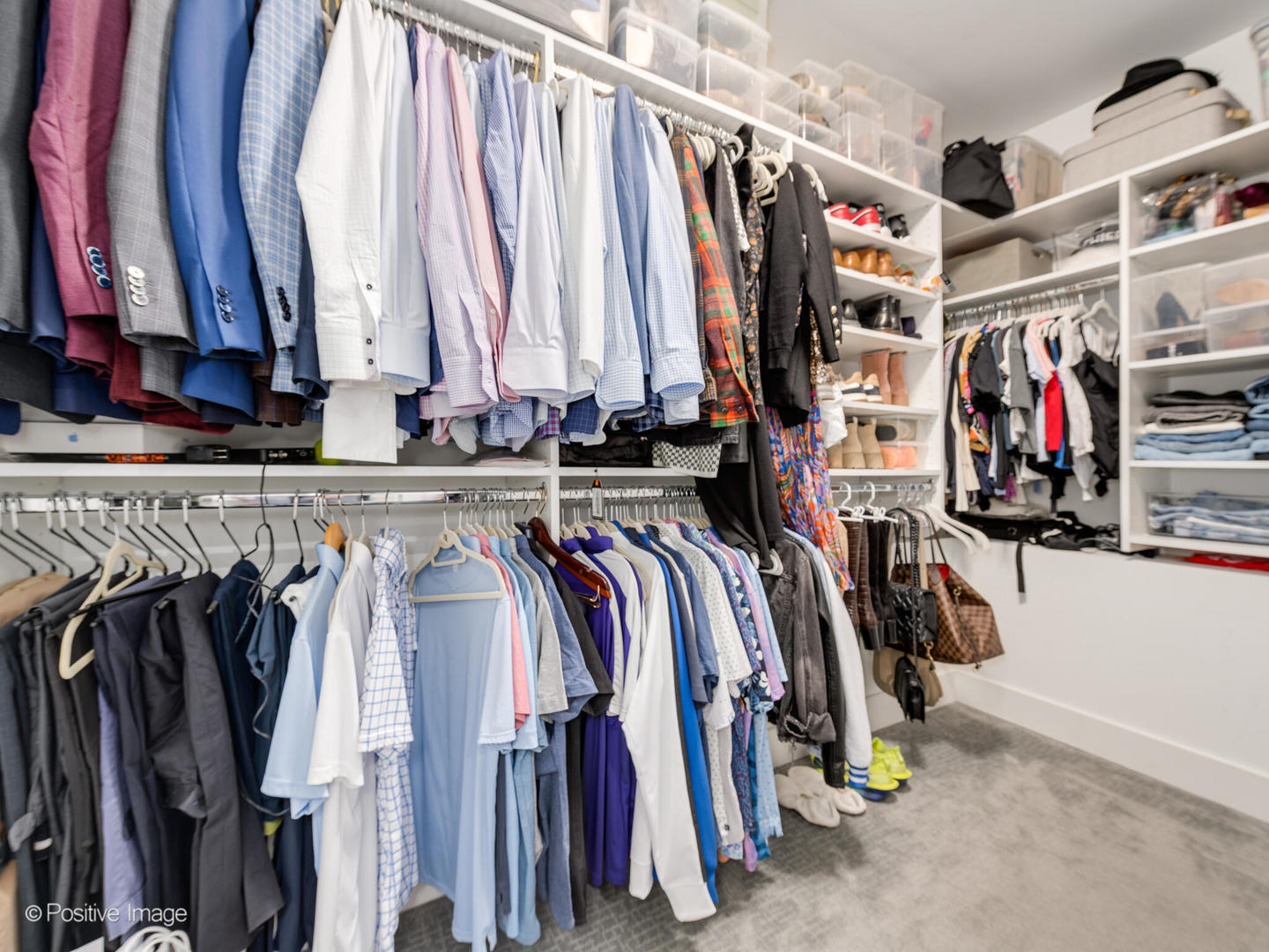 2315 West Roscoe Street, Unit 1 Chicago, IL 60618 - Photo 24 of 37 a view of walk in closet with clothes and shoes