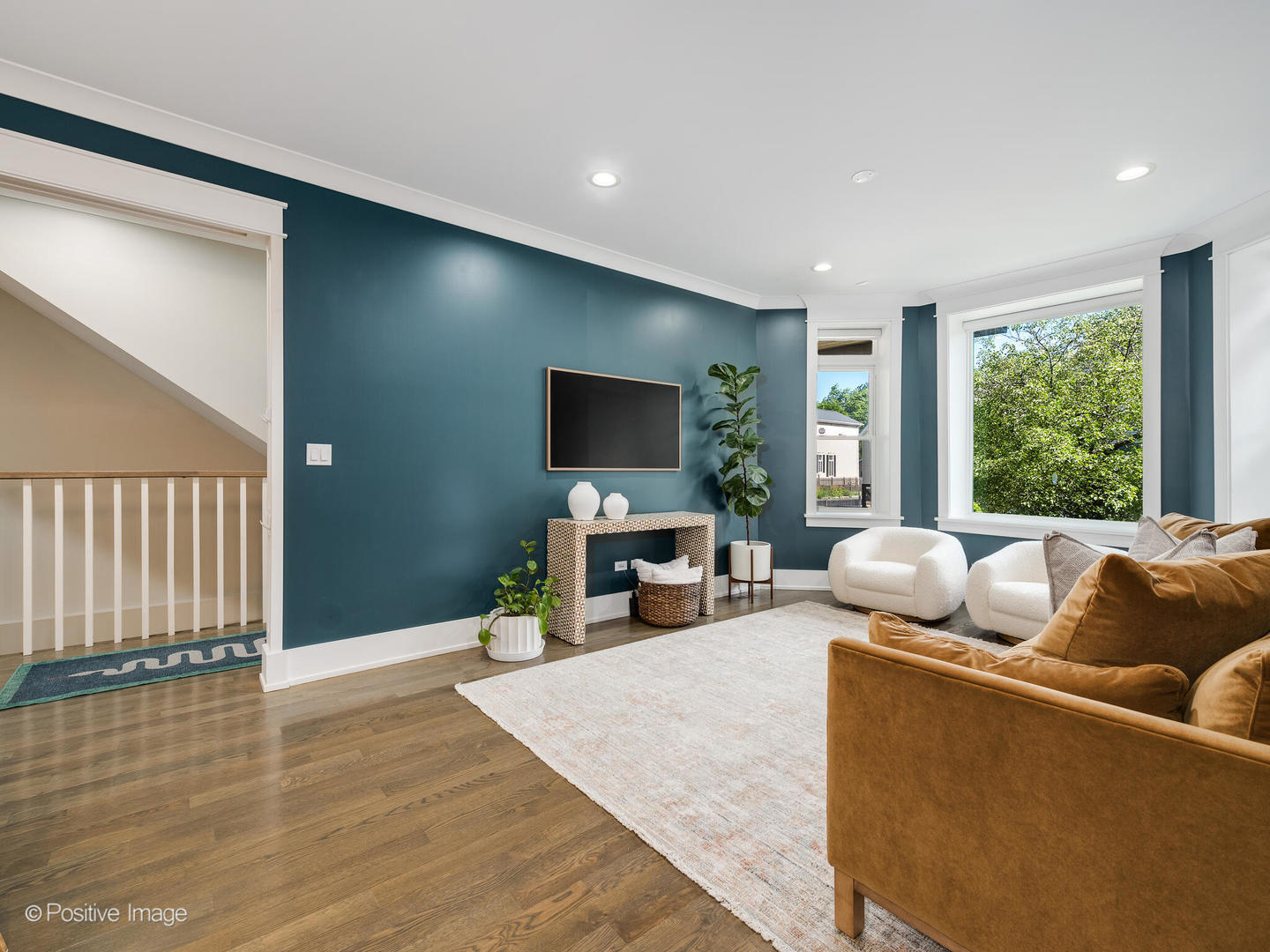 2315 West Roscoe Street, Unit 1 Chicago, IL 60618 - Photo 5 of 37 a living room with furniture and a flat screen tv