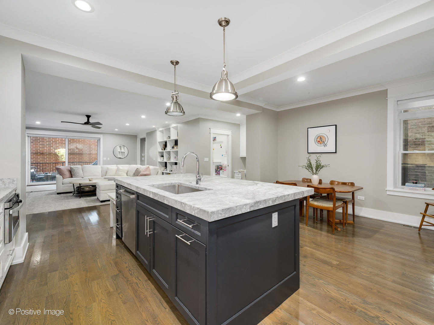 2315 West Roscoe Street, Unit 1 Chicago, IL 60618 - Photo 9 of 37 a kitchen with a stove and chairs