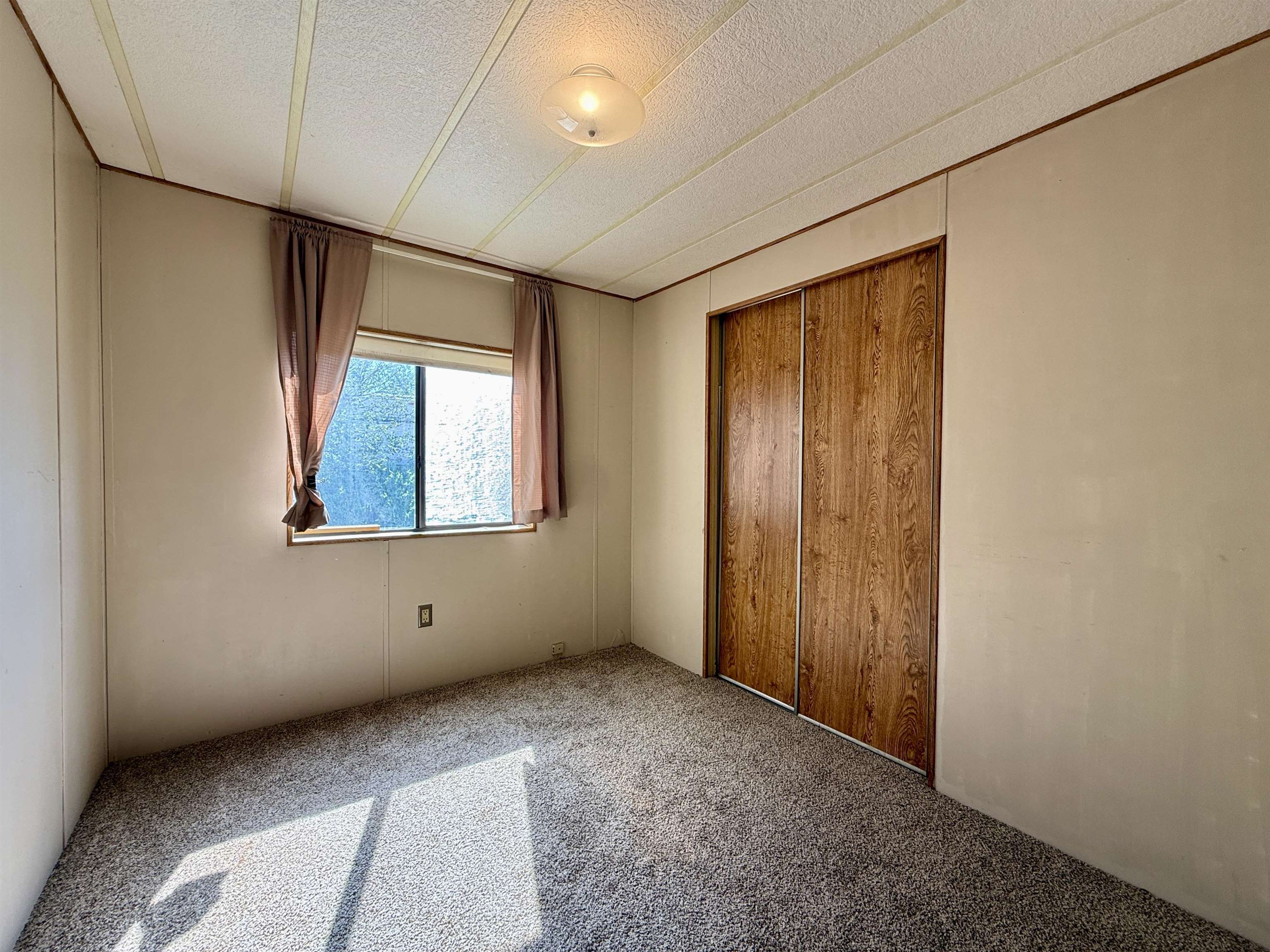 3251 E Road, Unit 33 Clifton, CO 81520 - Photo 15 of 28 an empty room with windows