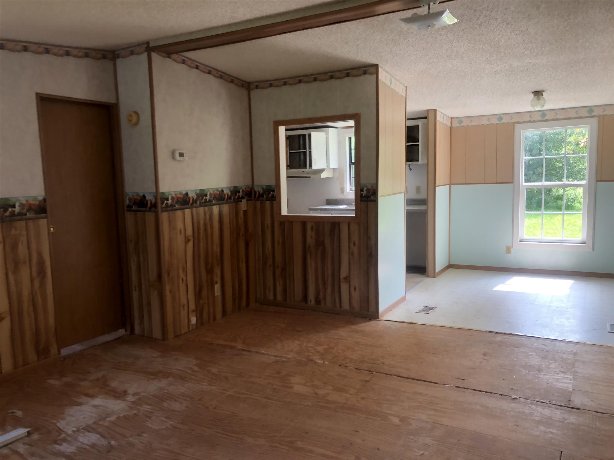2566 Chambliss Road Pleasant View, TN 37146 - Photo 3 of 7 an empty room with windows and closet