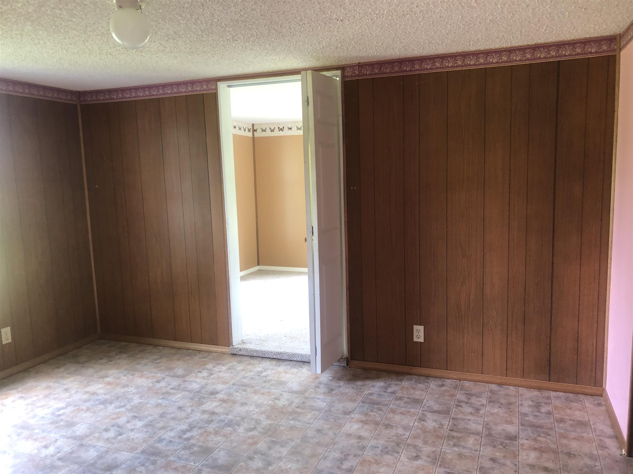 2566 Chambliss Road Pleasant View, TN 37146 - Photo 5 of 7 an empty room with windows