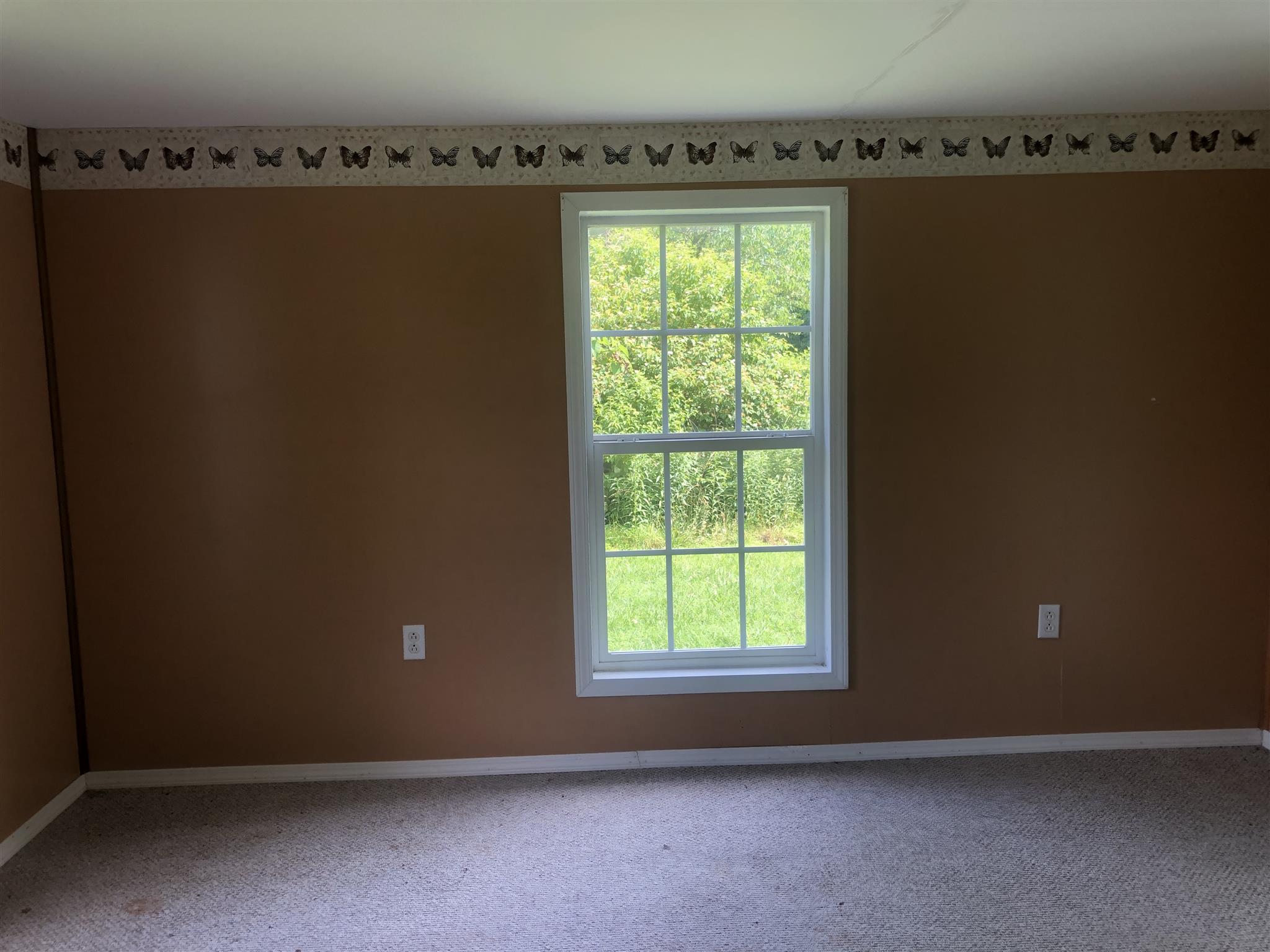 2566 Chambliss Road Pleasant View, TN 37146 - Photo 6 of 7 an empty room with a window