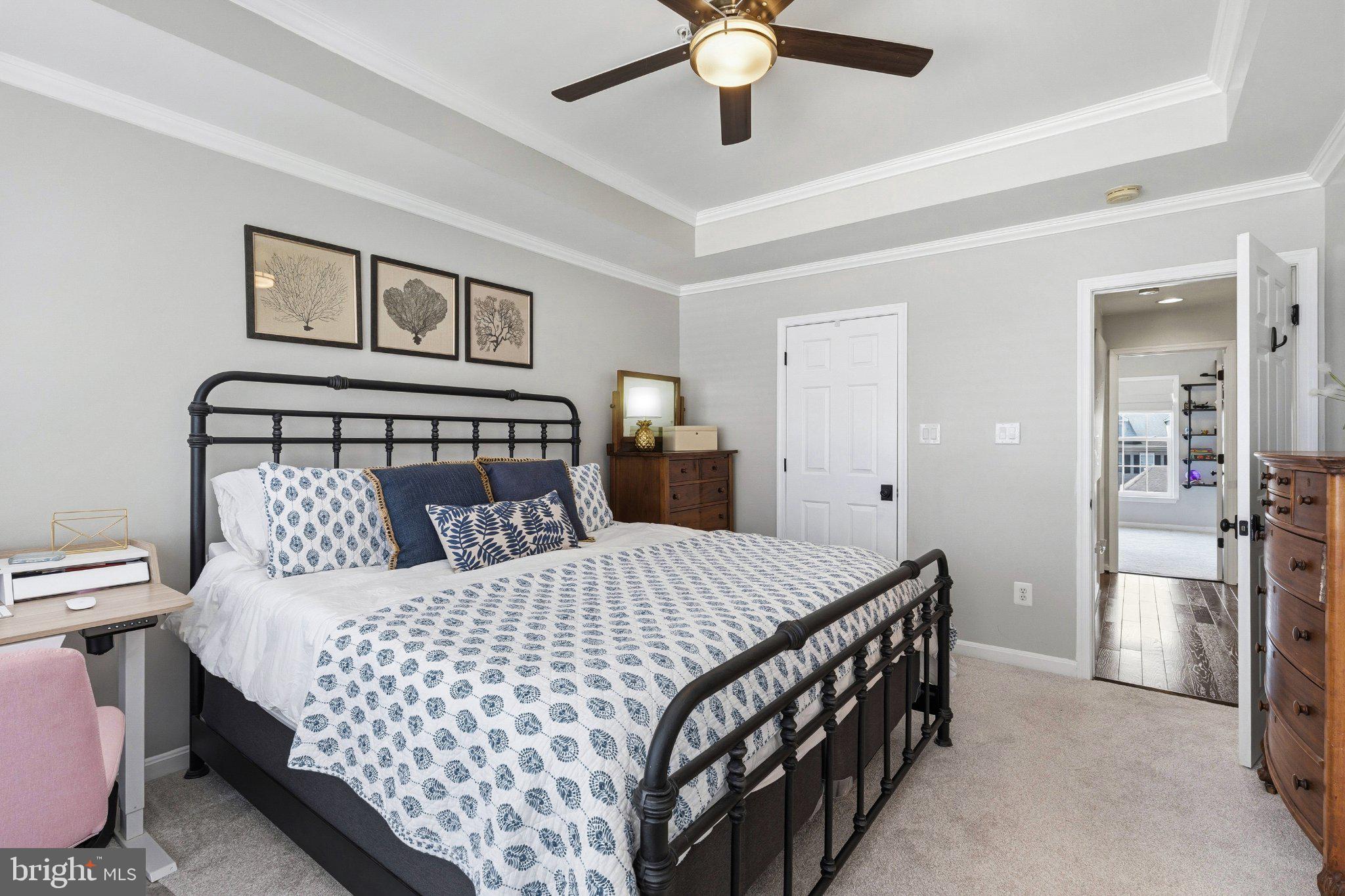 2668 Merlin Court Odenton, MD 21113 - Photo 18 of 42 a bedroom with a bed and painting on the wall