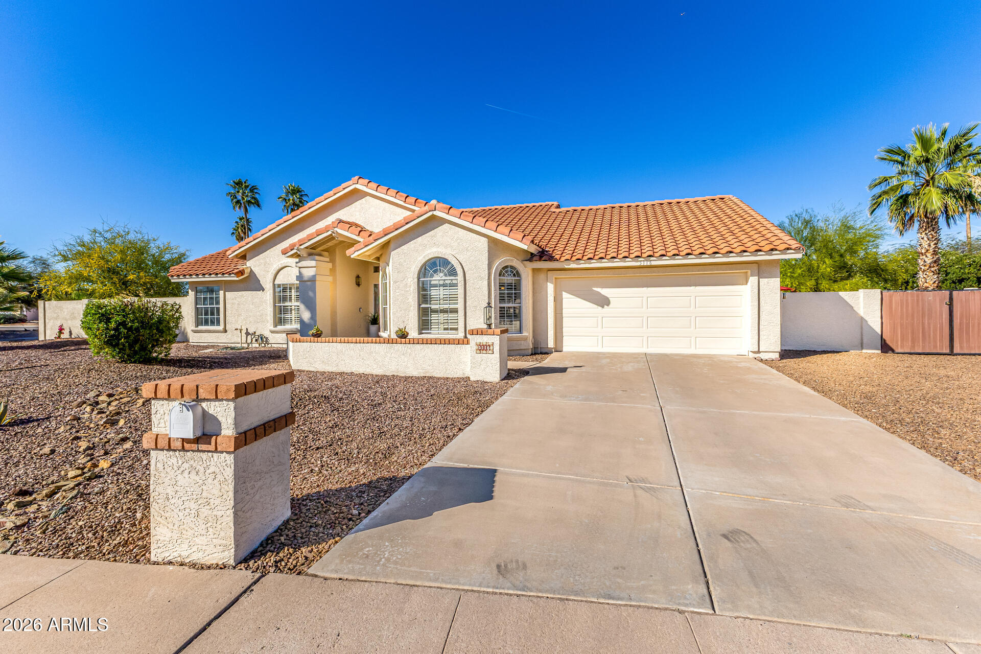 5116 East Wethersfield Road Scottsdale, AZ 85254 - Photo 1 of 53 a front view of a house with a porch