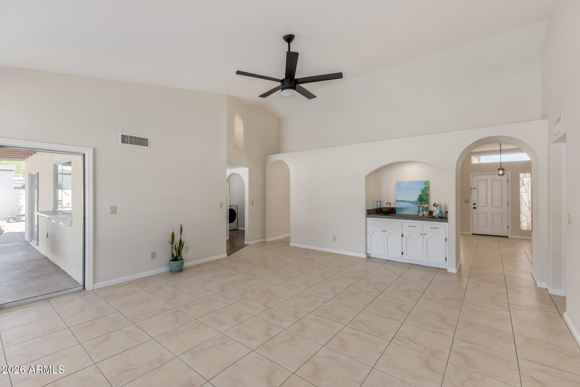 5116 East Wethersfield Road Scottsdale, AZ 85254 - Photo 14 of 53 a view of empty room with cabinet and fan
