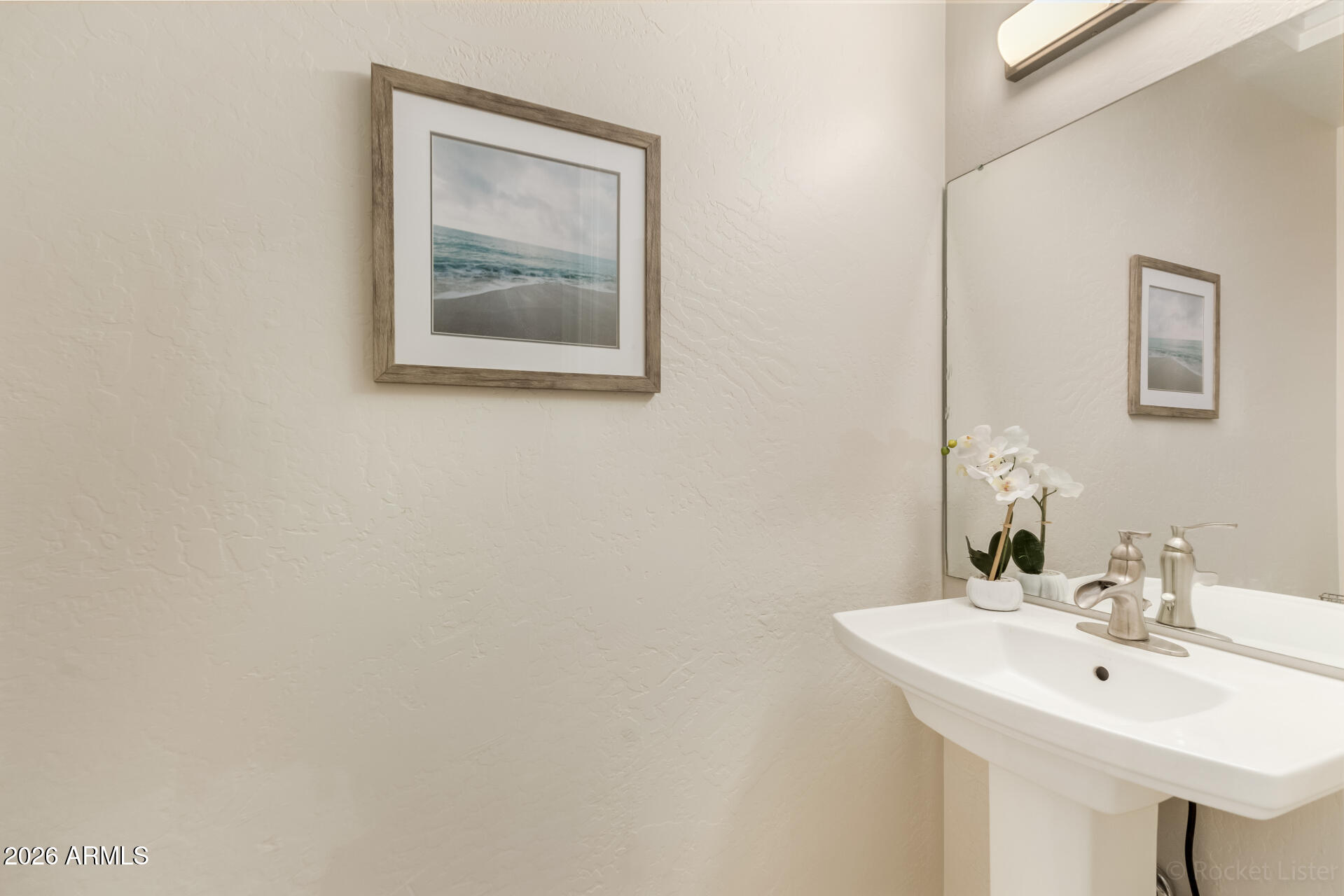 5116 East Wethersfield Road Scottsdale, AZ 85254 - Photo 20 of 53 a bathroom with a sink and a mirror