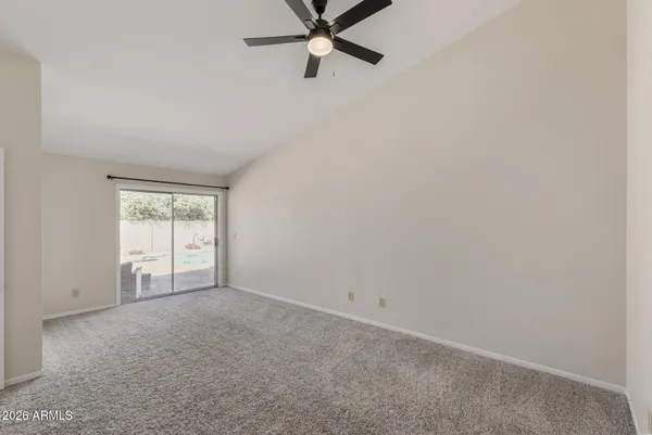 a view of a room with a ceiling fan