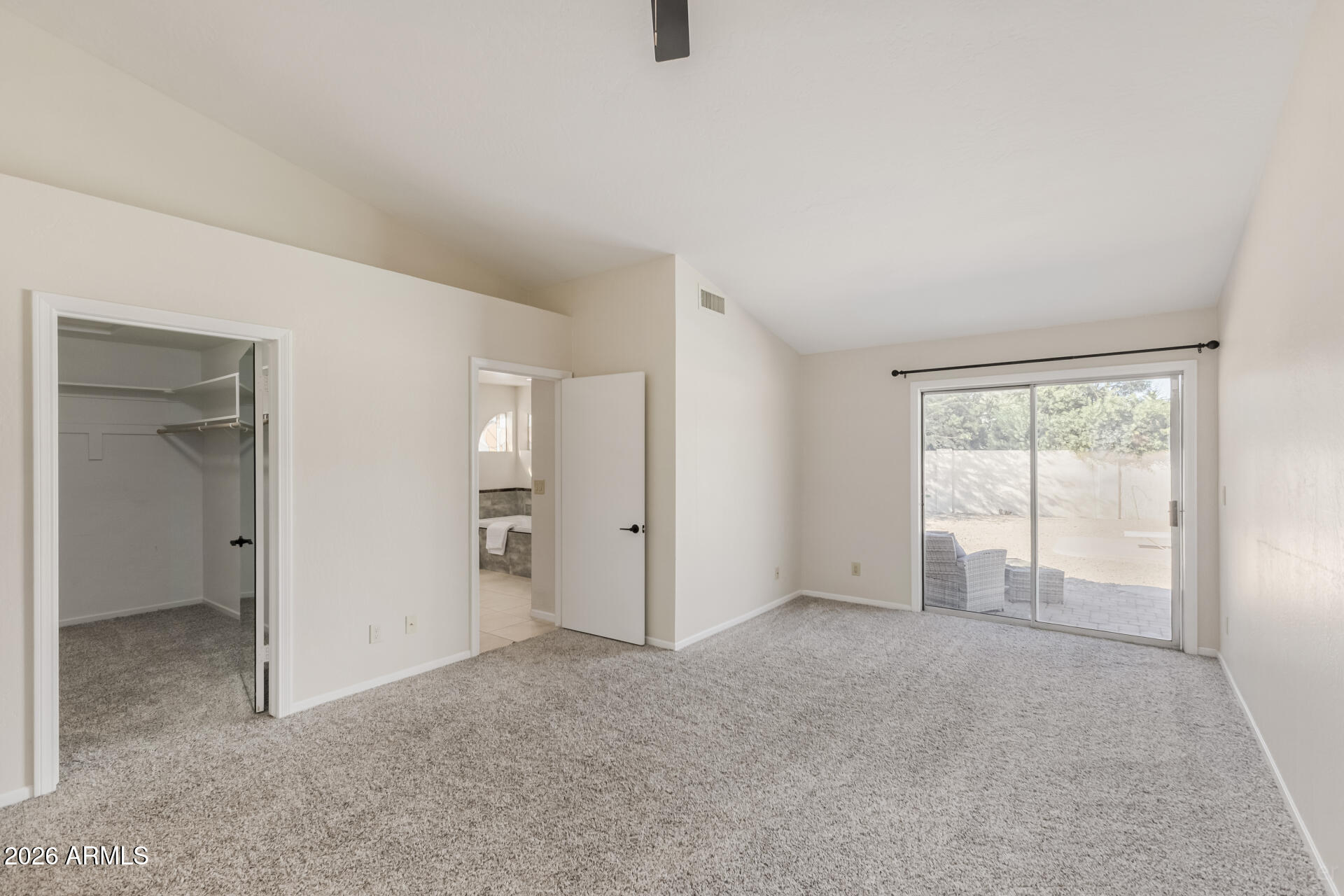 5116 East Wethersfield Road Scottsdale, AZ 85254 - Photo 24 of 53 an empty room with windows and closet