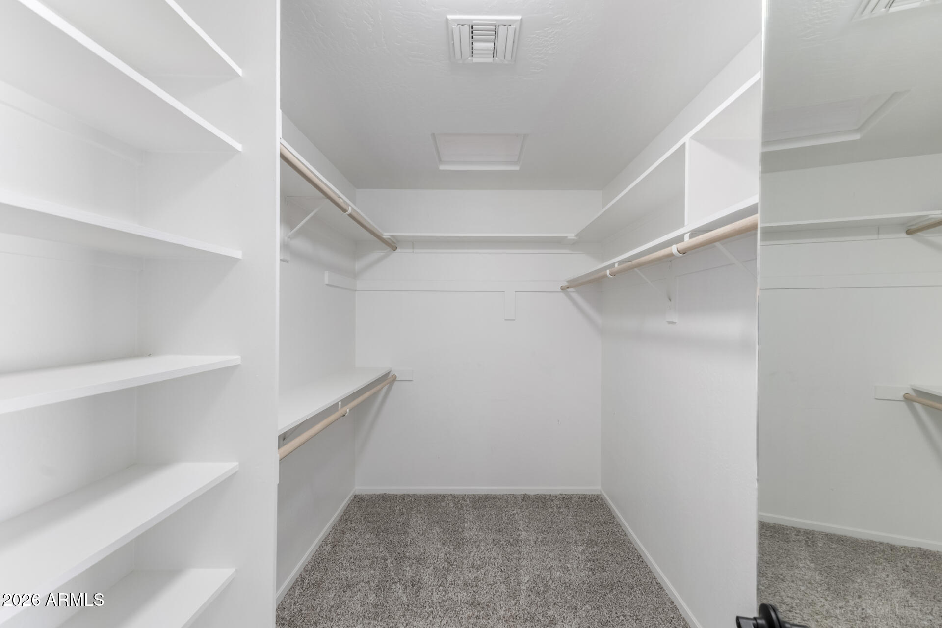 5116 East Wethersfield Road Scottsdale, AZ 85254 - Photo 25 of 53 a view of an empty walk in closet