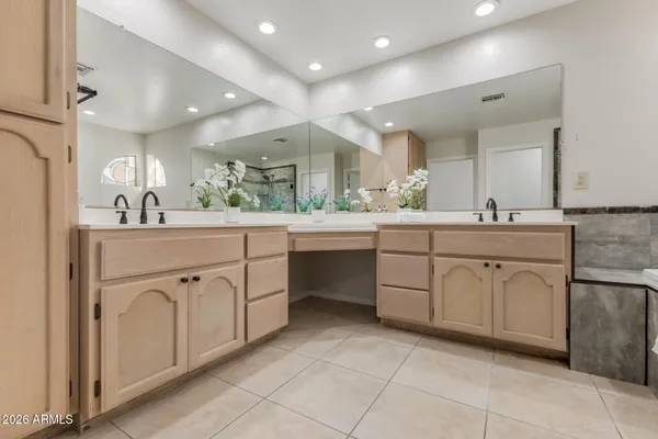 a white toilet sitting next to a white walls