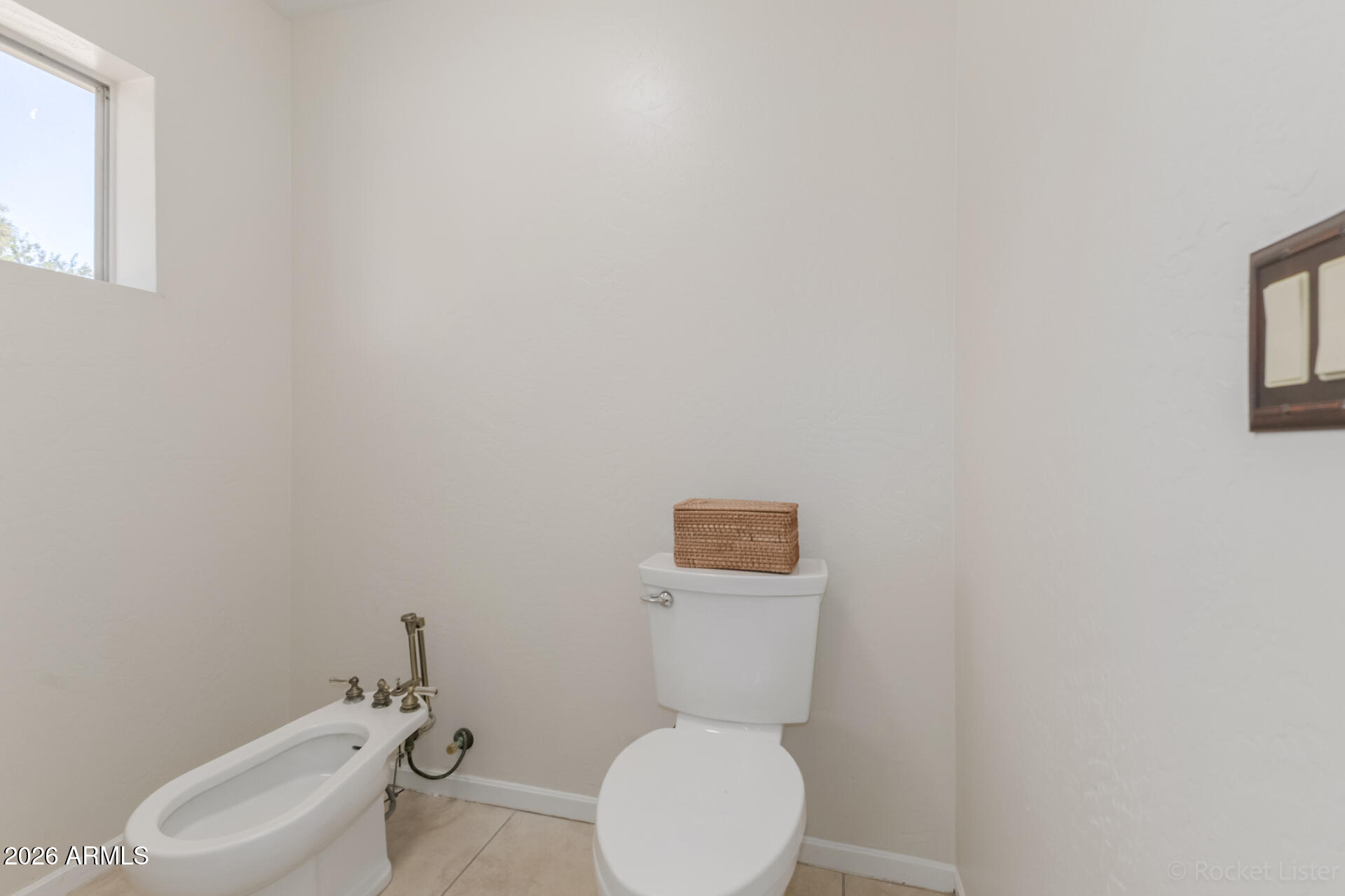 5116 East Wethersfield Road Scottsdale, AZ 85254 - Photo 29 of 53 a white toilet sitting next to a white walls