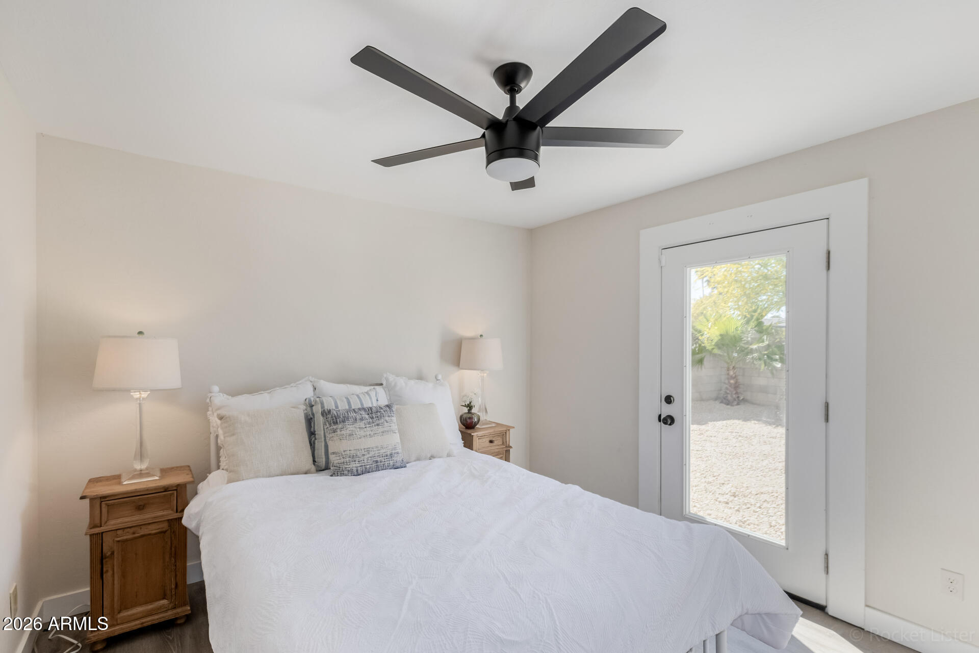 5116 East Wethersfield Road Scottsdale, AZ 85254 - Photo 30 of 53 a bedroom with a bed and a ceiling fan