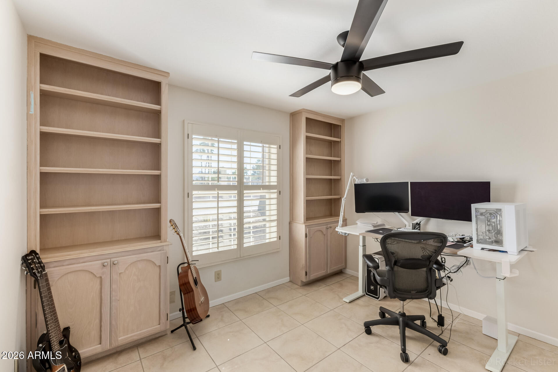 5116 East Wethersfield Road Scottsdale, AZ 85254 - Photo 35 of 53 a view of a workspace with furniture and a window