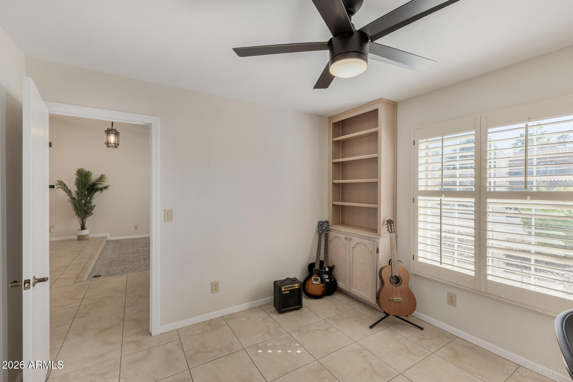 5116 East Wethersfield Road Scottsdale, AZ 85254 - Photo 36 of 53 a view of a room with gym equipment and windows