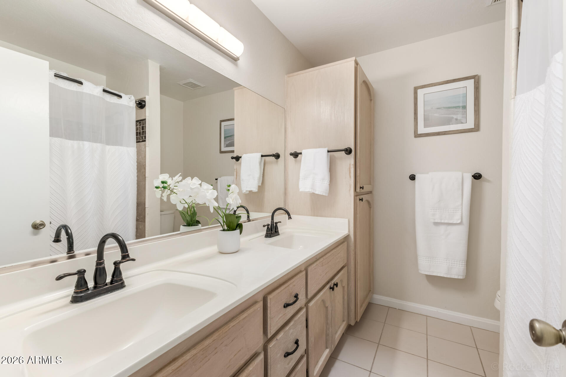 5116 East Wethersfield Road Scottsdale, AZ 85254 - Photo 37 of 53 a bathroom with a double vanity sink and a mirror