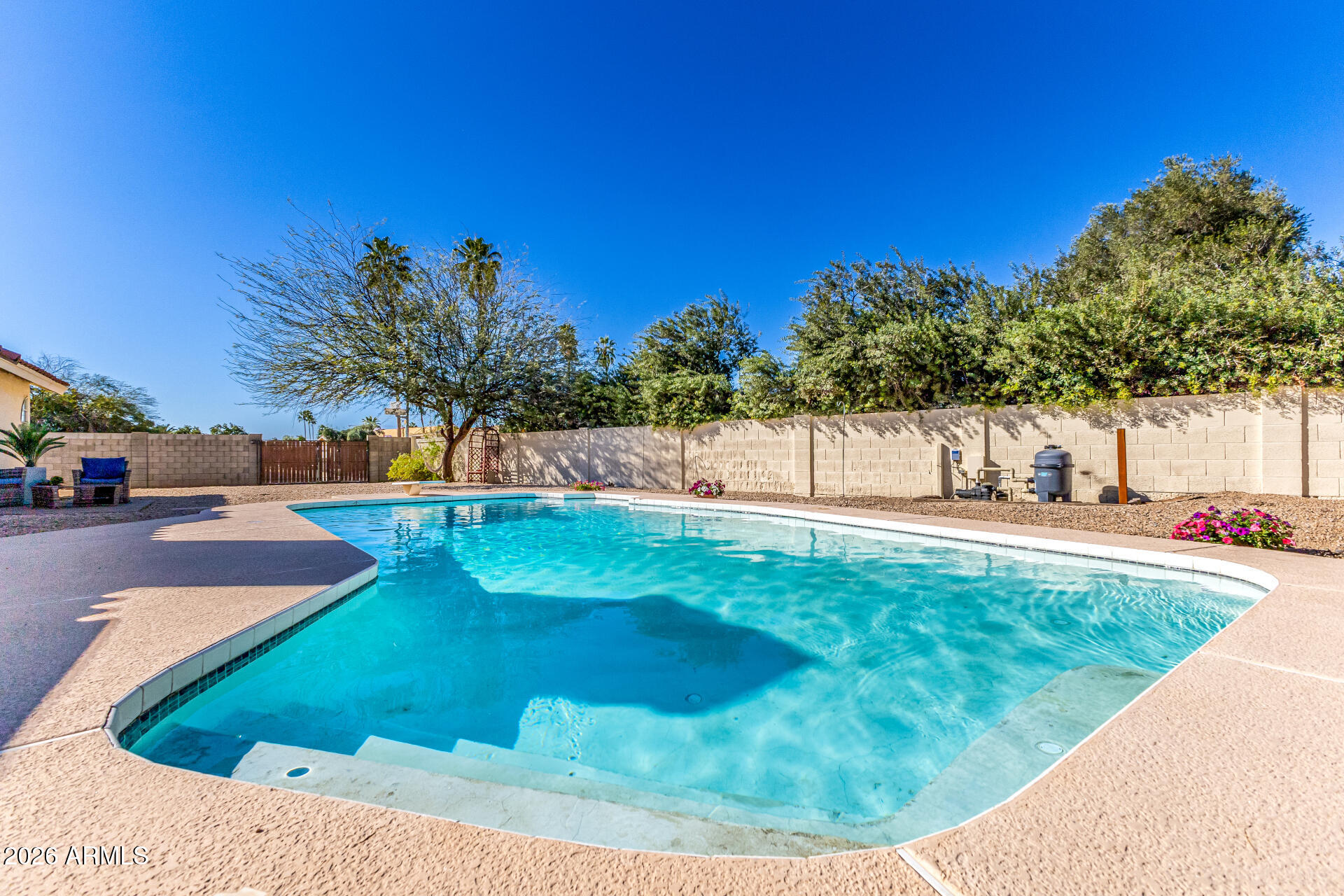 5116 East Wethersfield Road Scottsdale, AZ 85254 - Photo 45 of 53 a view of a swimming pool with a patio
