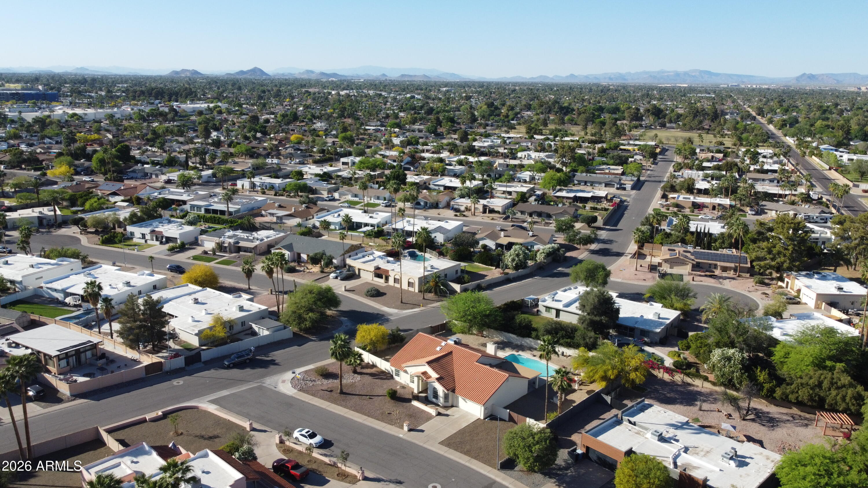 5116 East Wethersfield Road Scottsdale, AZ 85254 - Photo 51 of 53 an aerial view of a city with lots of residential buildings