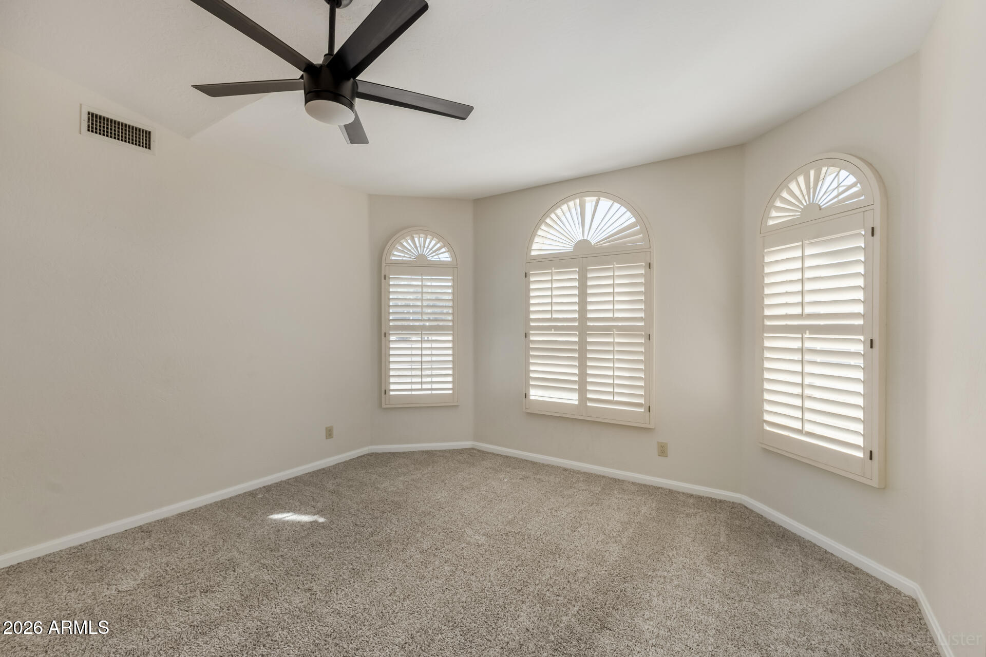 5116 East Wethersfield Road Scottsdale, AZ 85254 - Photo 8 of 53 a view of an empty room with a window