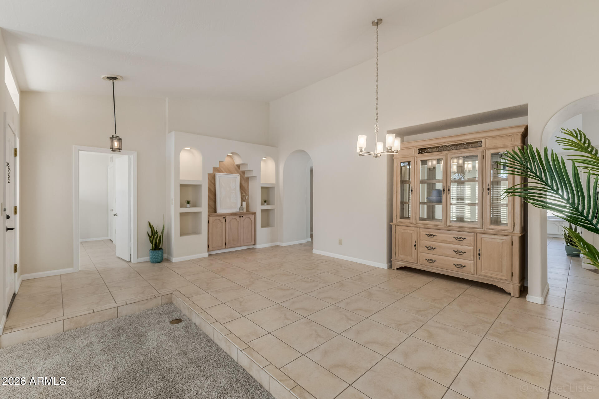5116 East Wethersfield Road Scottsdale, AZ 85254 - Photo 9 of 53 a view of a kitchen with furniture and a window