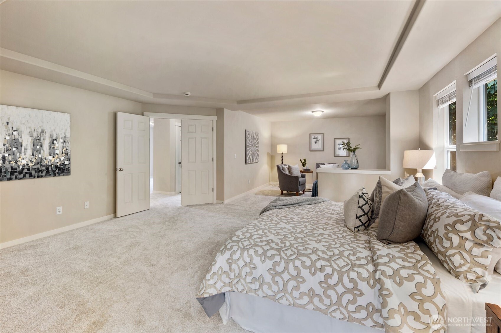 21705 38th Drive Southeast Bothell, WA 98021 - Photo 22 of 40 a spacious bedroom with a large bed and a chandelier