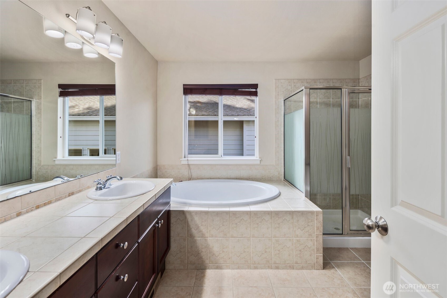 21705 38th Drive Southeast Bothell, WA 98021 - Photo 23 of 40 a bathroom with a granite countertop sink a toilet and shower