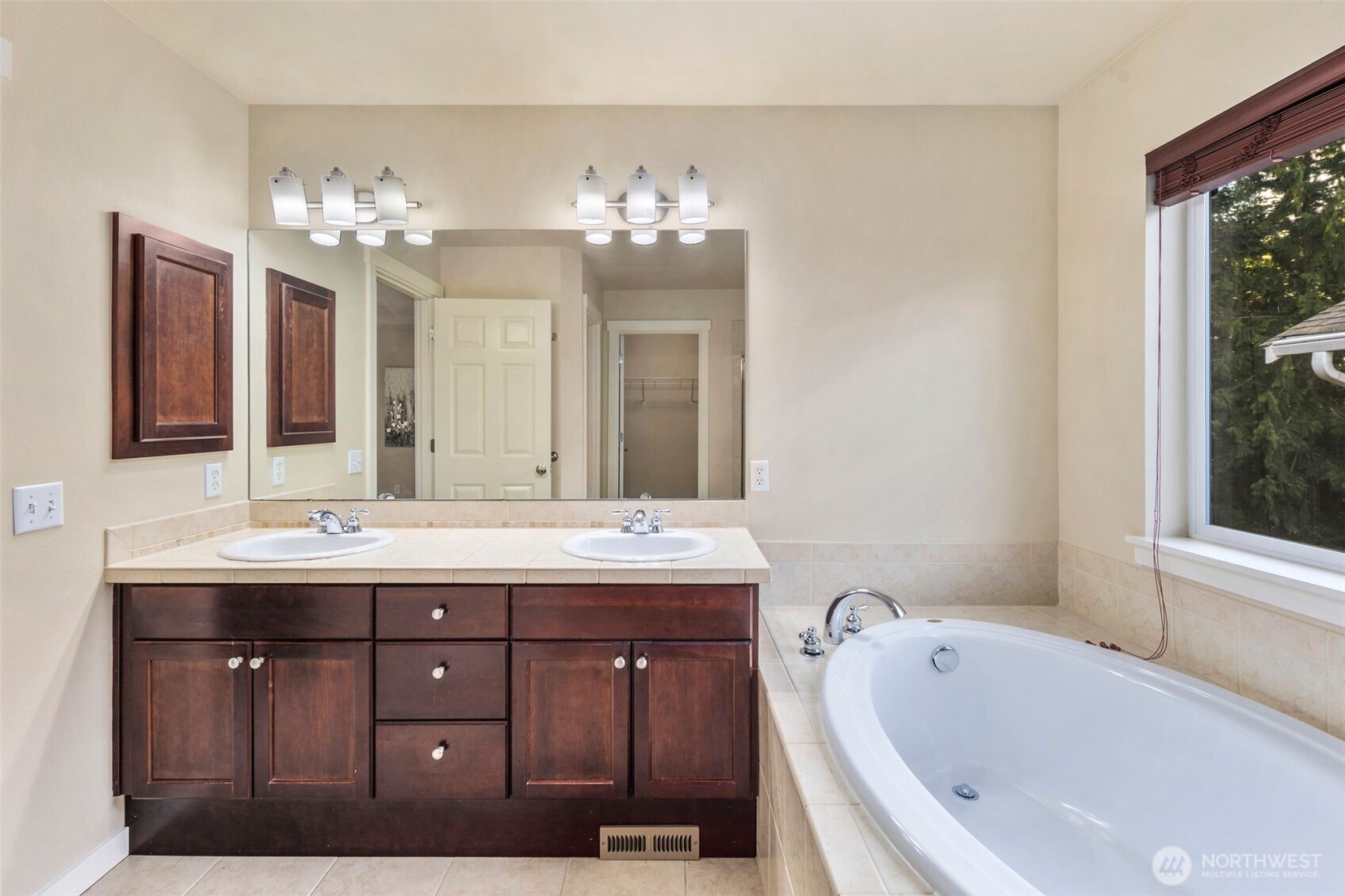 21705 38th Drive Southeast Bothell, WA 98021 - Photo 24 of 40 a bathroom with a tub sink and mirror