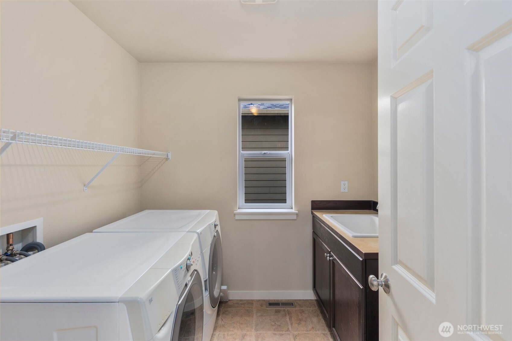 21705 38th Drive Southeast Bothell, WA 98021 - Photo 29 of 40 a utility room with a stove dryer and washer