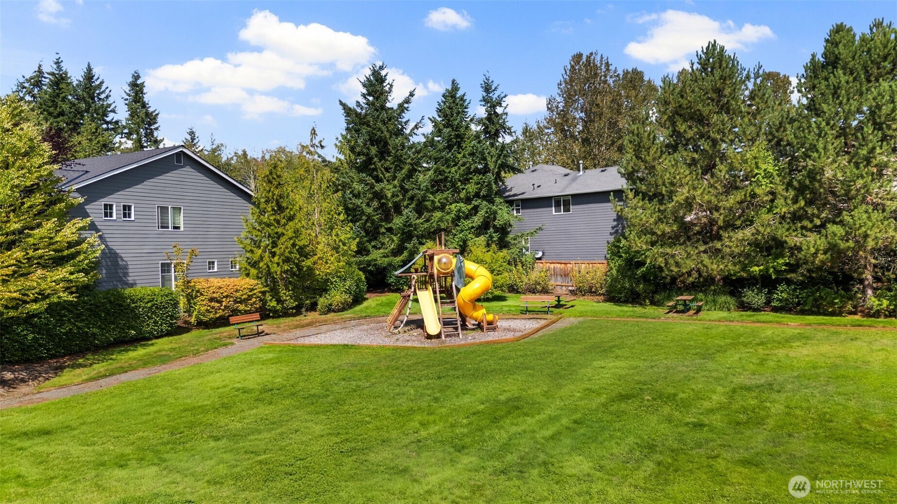 21705 38th Drive Southeast Bothell, WA 98021 - Photo 36 of 40 a view of a chair and table in backyard of the house